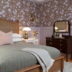 Queen bed in a room with antique furnishings