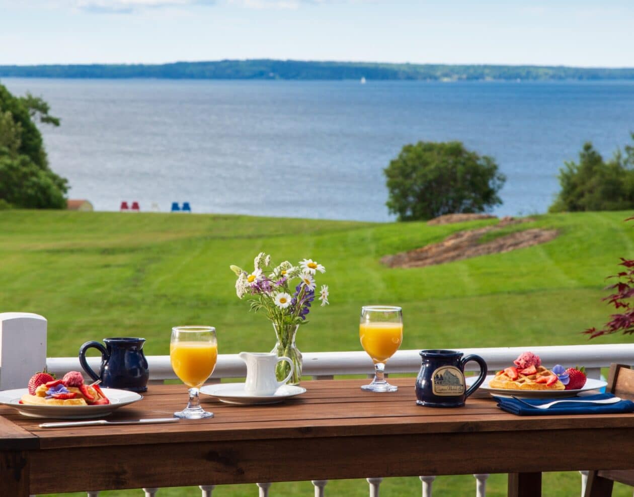 Spring breakfast set with views of the water and lawn