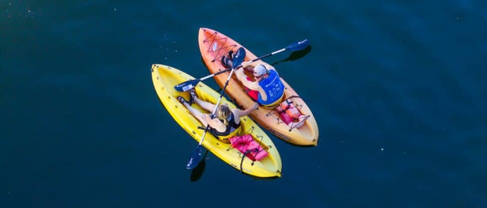 view from above: a couple kayaking out in the open water