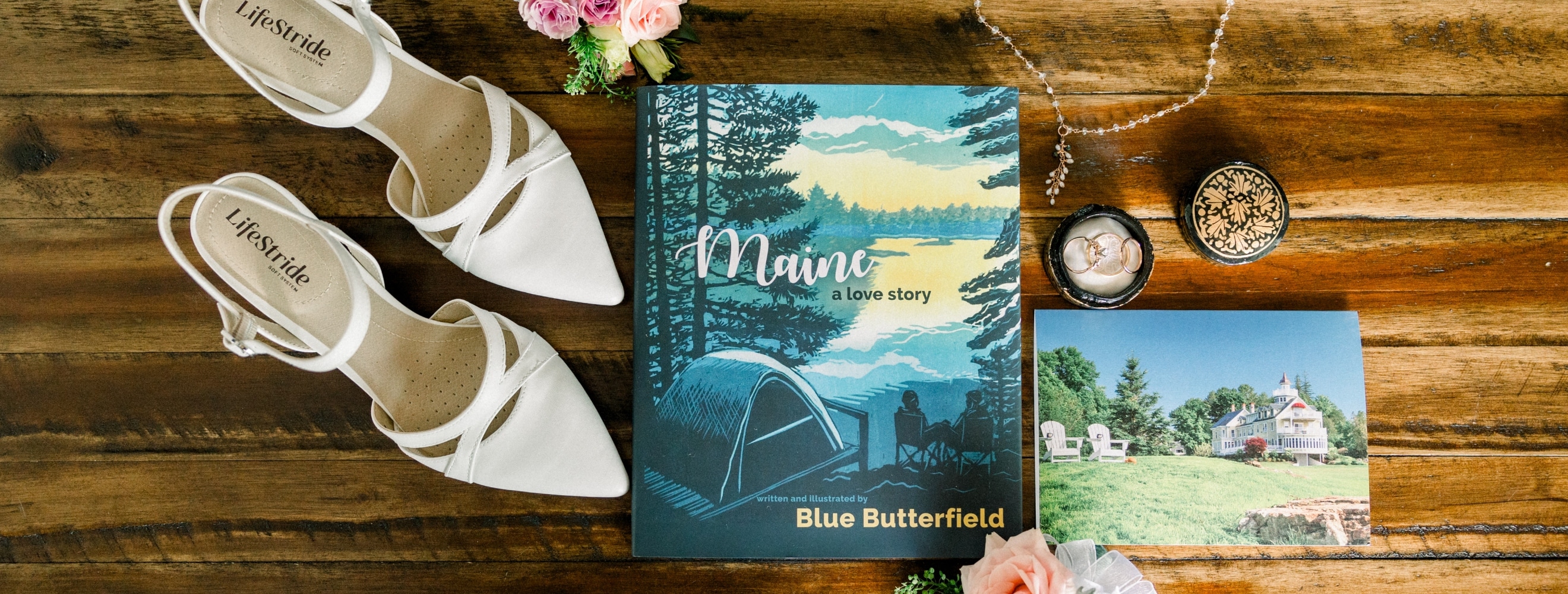 Waterfront Maine wedding details: shoes, book, necklace, flowers